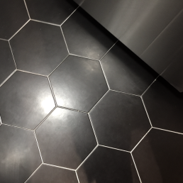 Black artisinal hex tiles uai