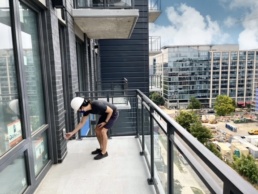 Tribeca buyer inspecting balcony
